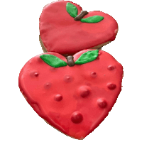 Two heart-shaped strawberry specialty cookies from Kind House Ukraine Bakery.