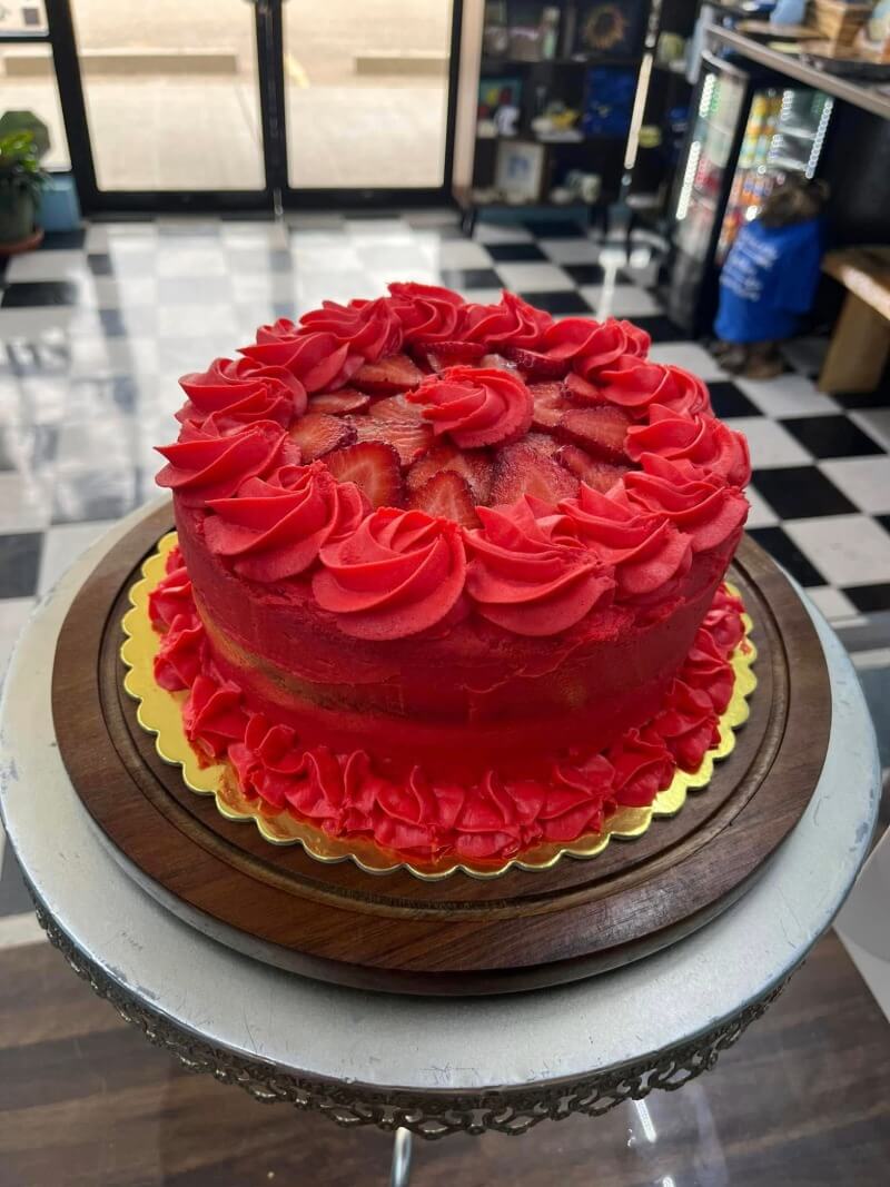 A strawberry cake with frosting from Kind House Ukraine Bakery in Amarillo, TX.